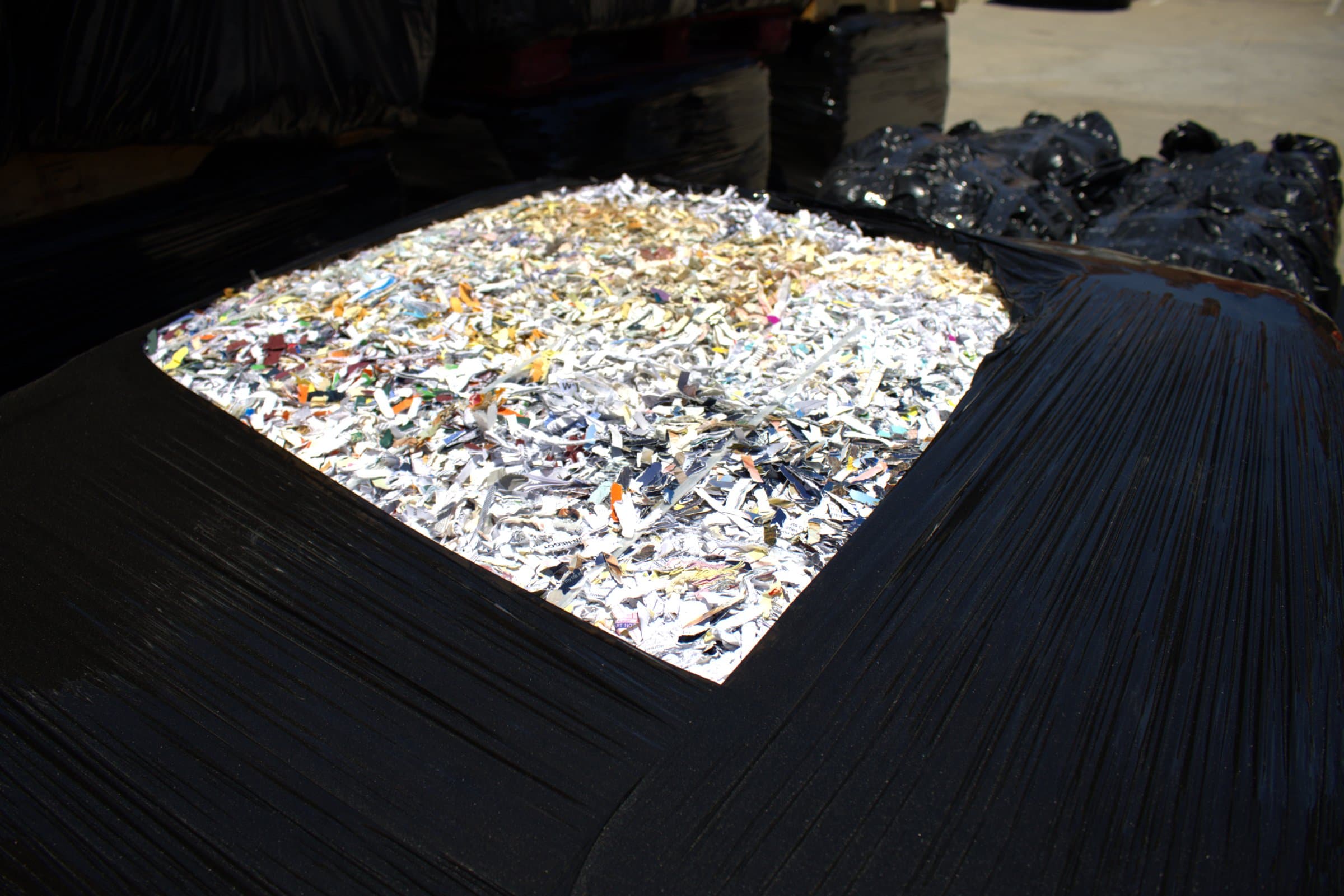 Disassembled drives stacked for shredding